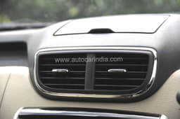 Squared-off central air-con vents are similar to those on the Micra.